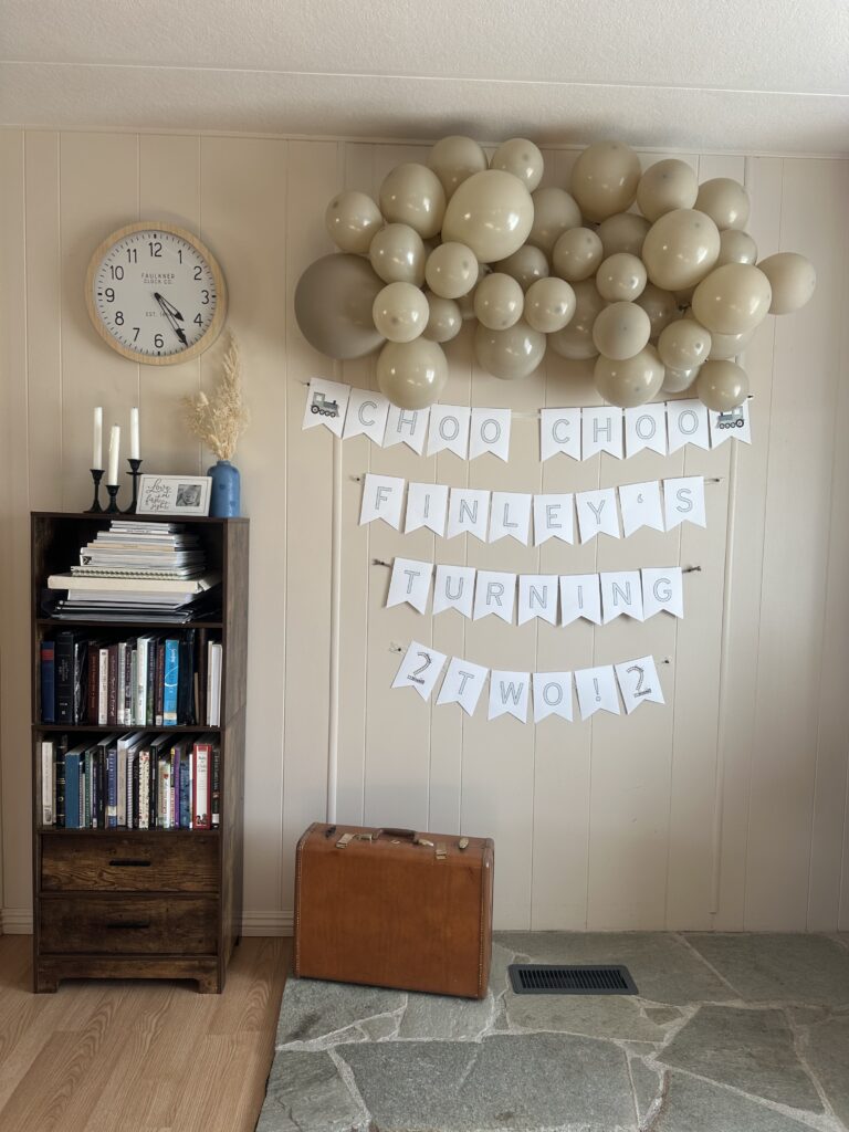 bookshelf with staged birthday decor