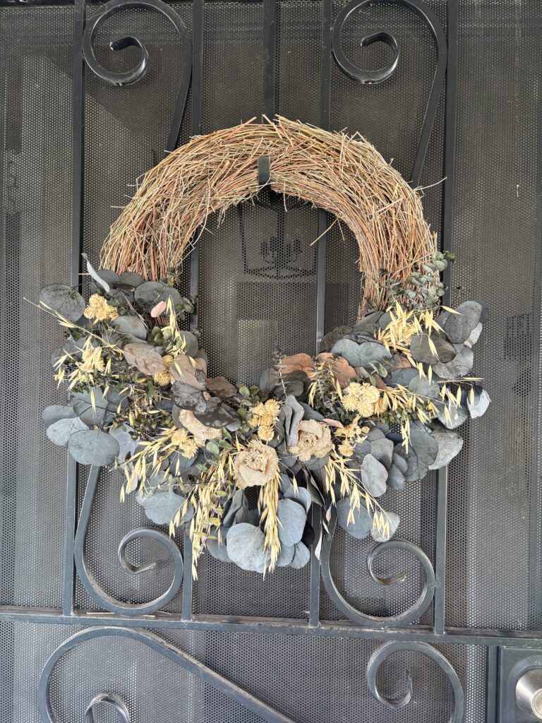 My wreath hanging on the front door.