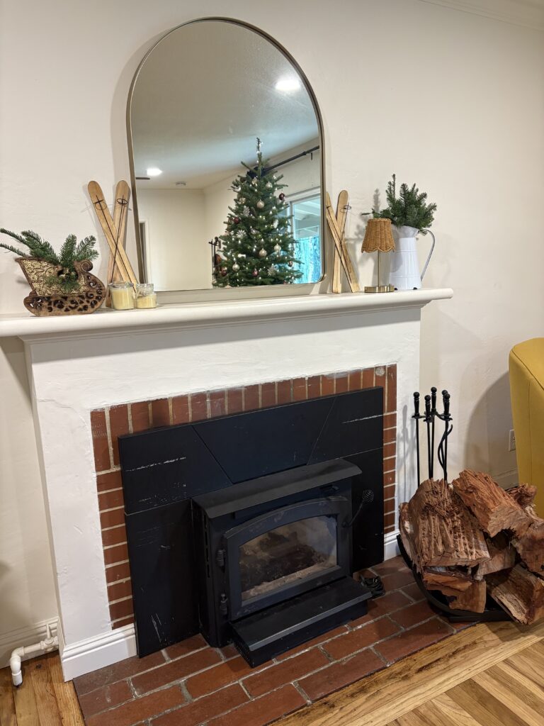 This is how our mantle turned out with all of the Christmas tree clippings.