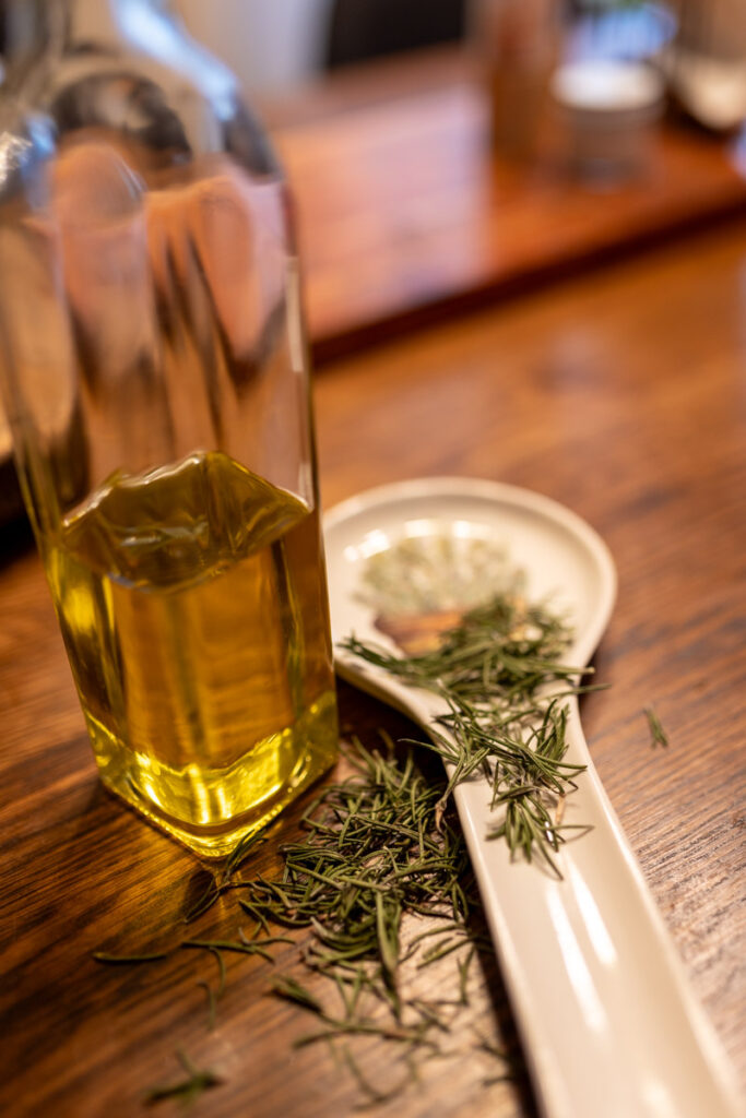 olive oil with rosemary on the side
