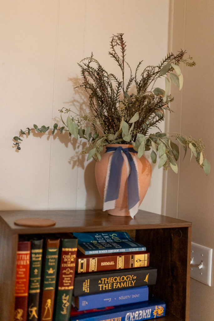 vase with dried greenery and a ribbon