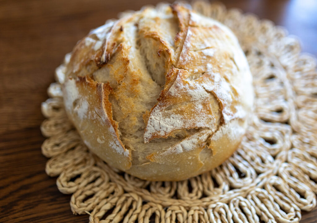 sourdough bread on a woven mat