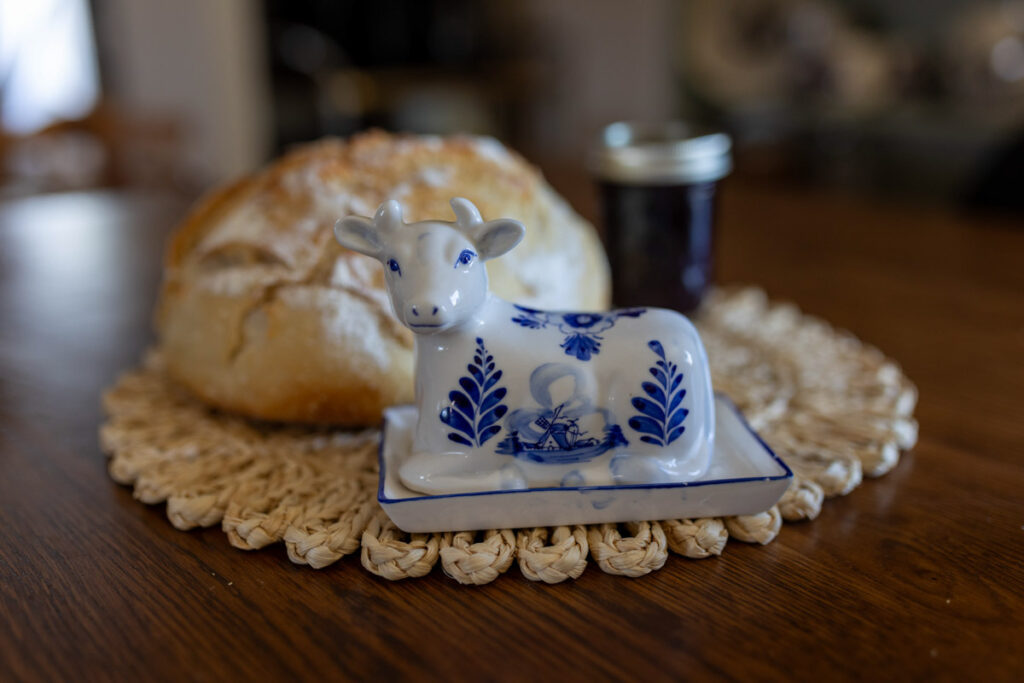 Delft white and blue cow butter dish with sourdough bread and jam