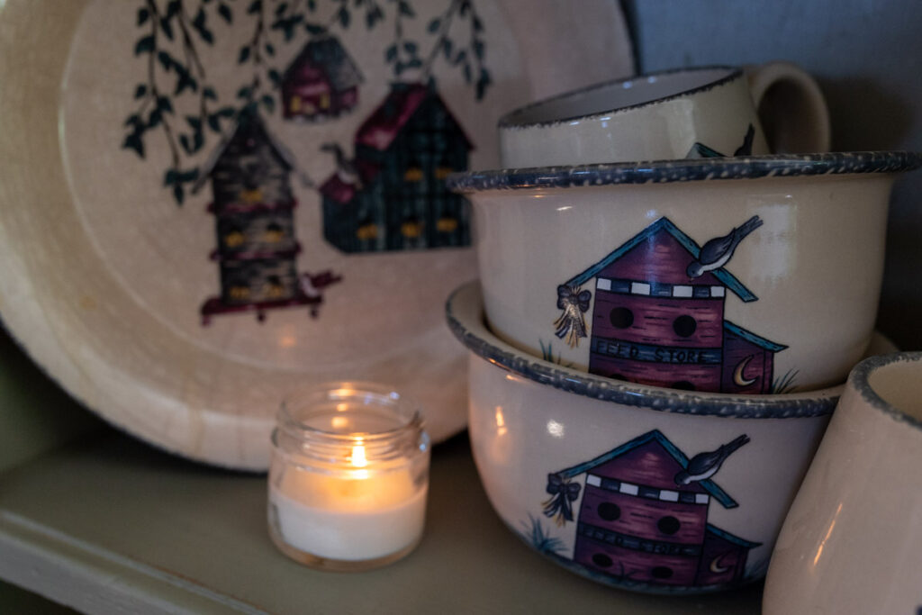 bowls and plates displayed on a hutch
