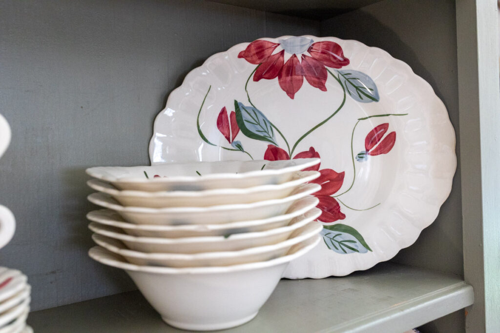 Blue Ridge poinsettia dishes on a hutch