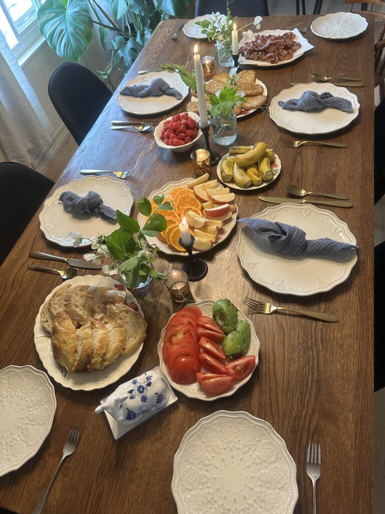 food on the table with sweet pea flowers