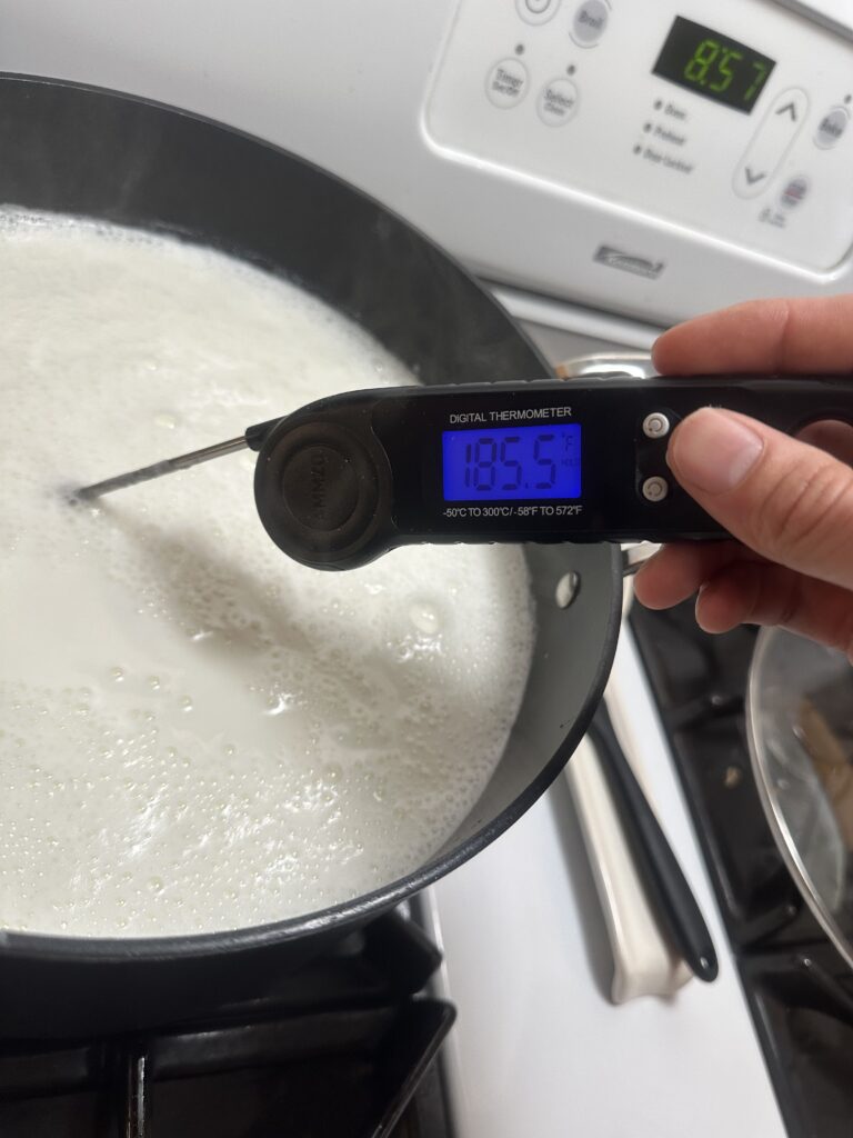 thermometer indicating that the milk reached 185 degrees