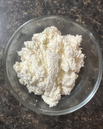 homemade cottage cheese in a glass bowl