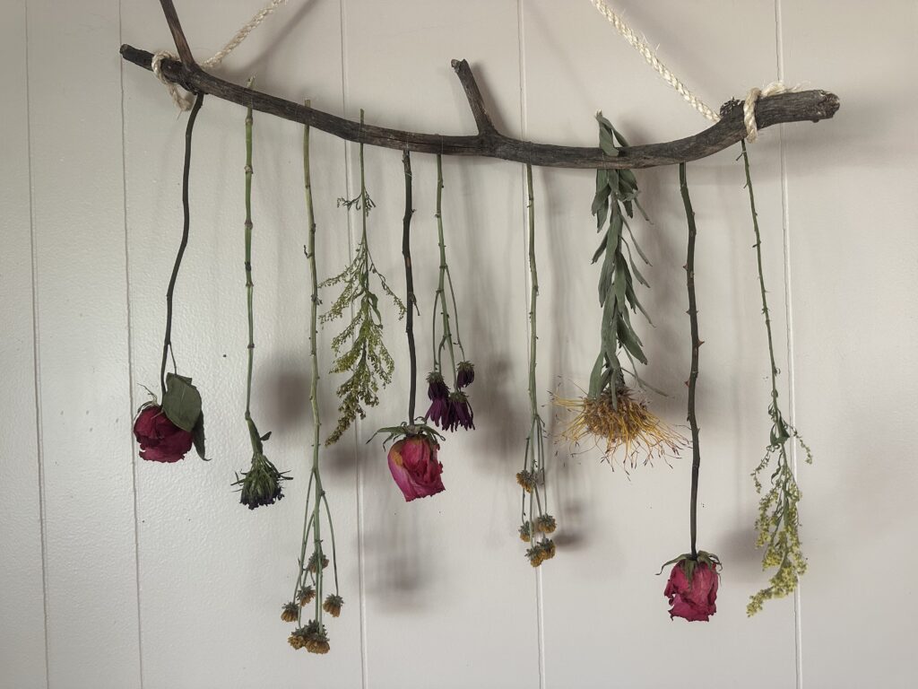 dried flowers hanging on a stick for decor