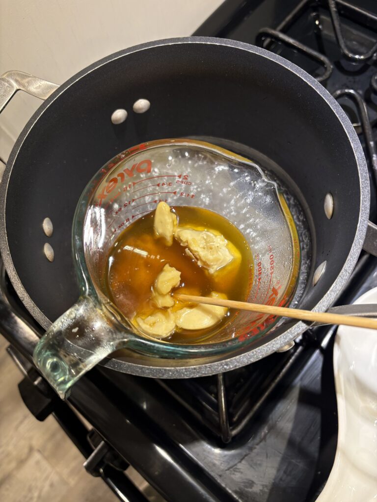 Melting the beeswax in a double boiler.