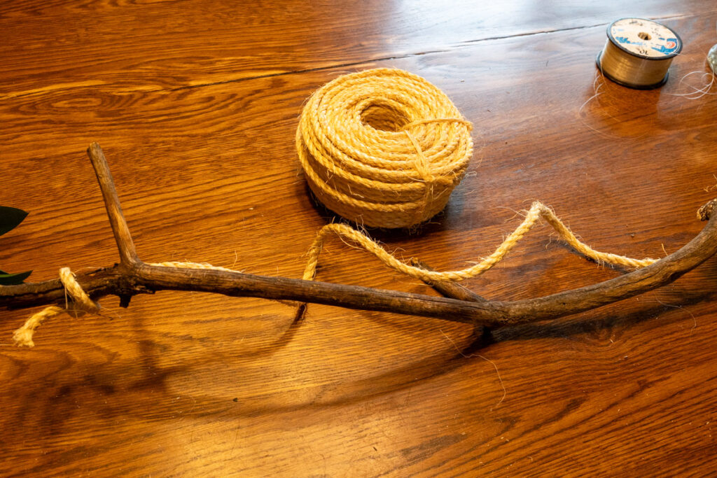 tying a string onto a stick