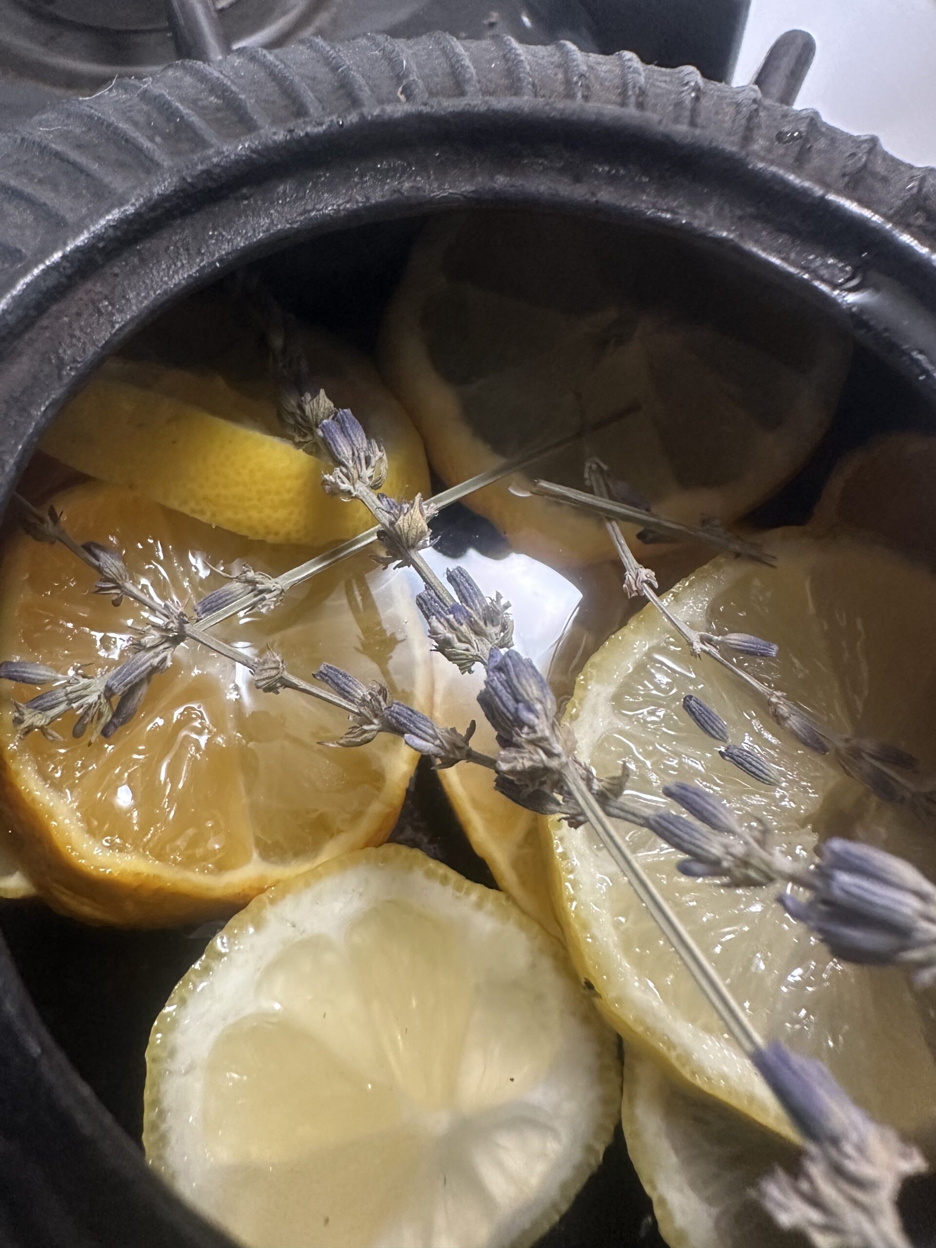 close up shot of lemon and lavender in kettle