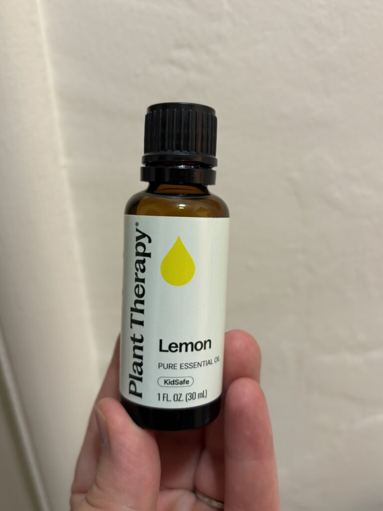 Lemon essential oil bottle that I used to clean my AC return vent.