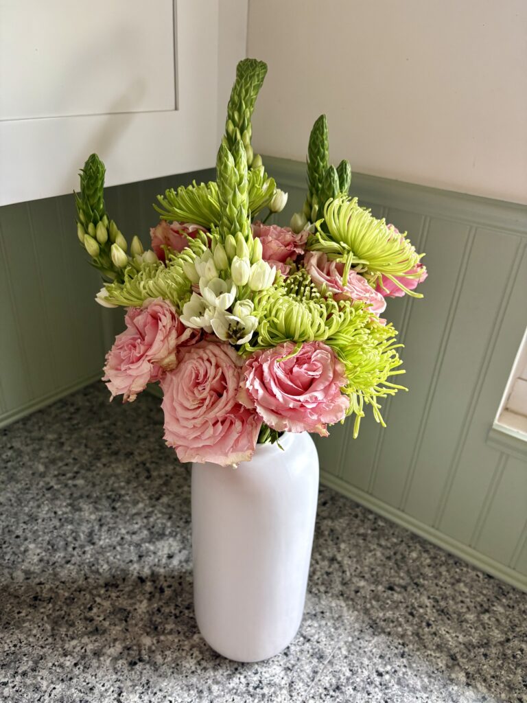 A pretty bouquet with the bead board seen in the background.