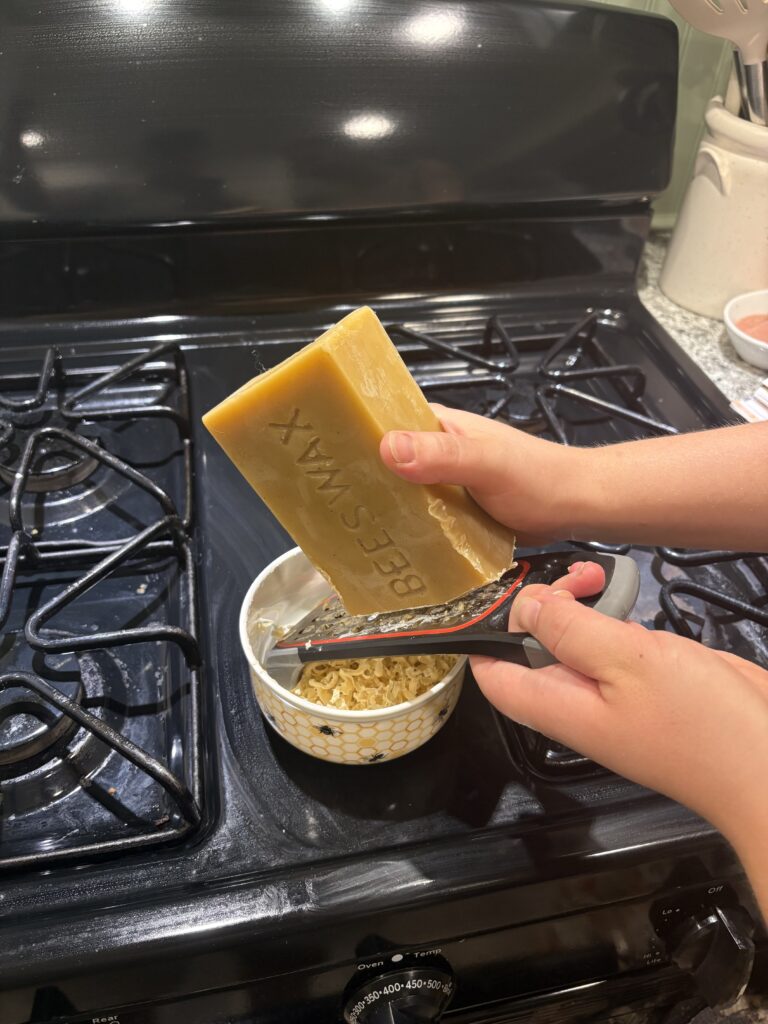 Grating the beeswax.